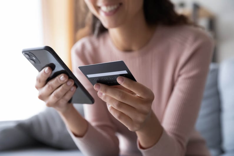 Customer making online purchase through smartphone