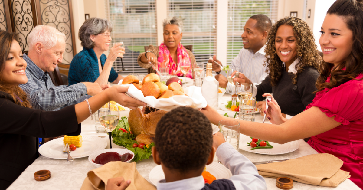 A multi-generational family enjoys a holiday meal.