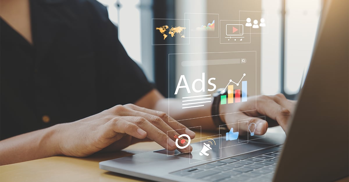 Young man using laptop with Ads dashboard digital marketing strategy analysis for branding.